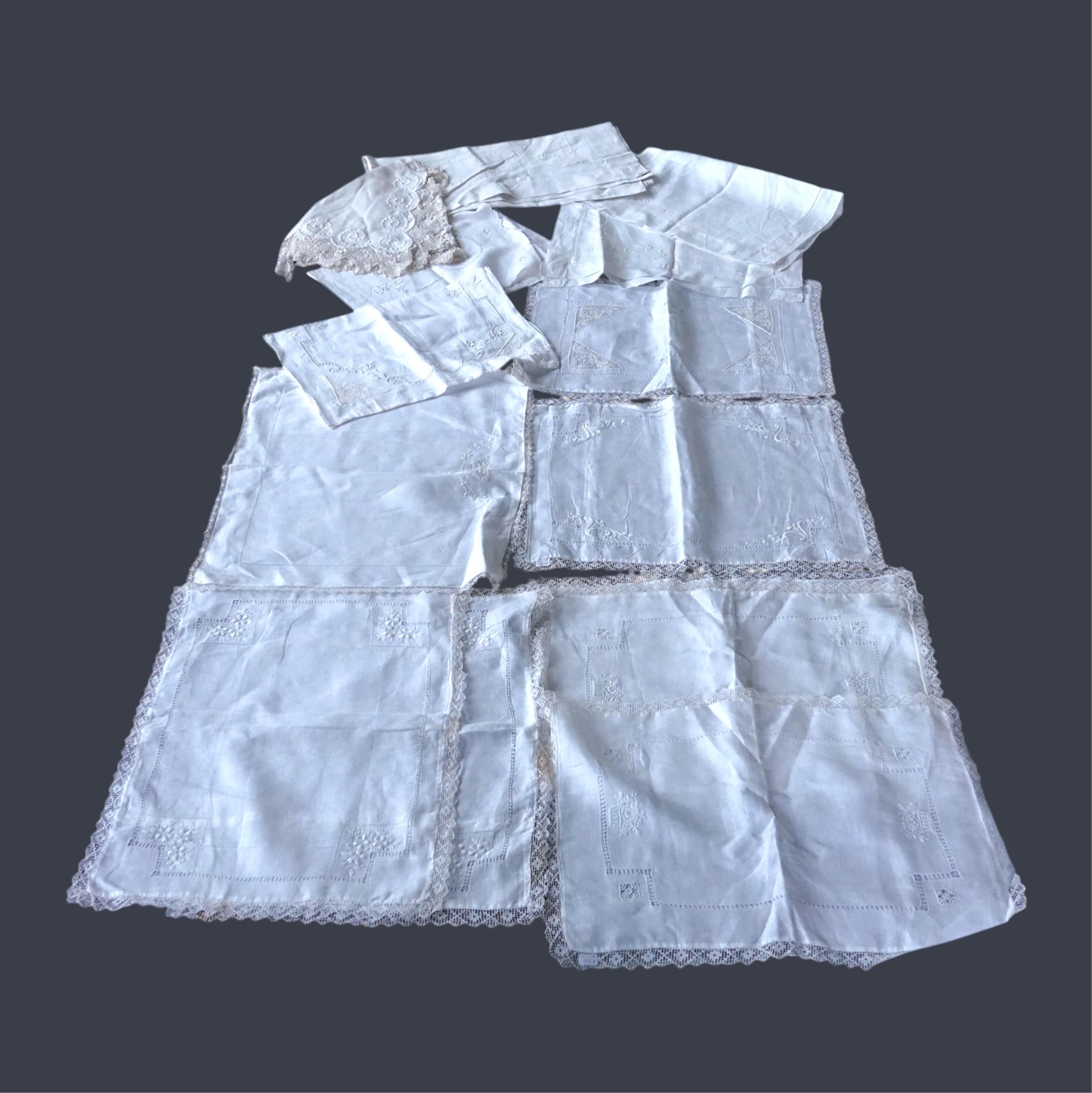 Ten fine linen baby’s pillowcases, eight inset and edged with fillet lace, together with a large fine linen red bordered 19th century ladies kerchief, and three other items. (14) Kerchief 54cm x 58cm. Condition - all ite